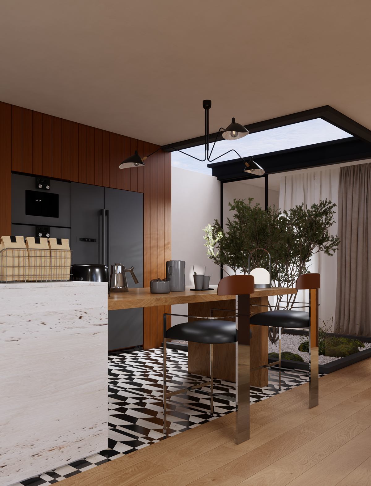 A kitchen with a travertine-look island, dark built-in ovens and timber walls, beside a planted courtyard under a skylight.