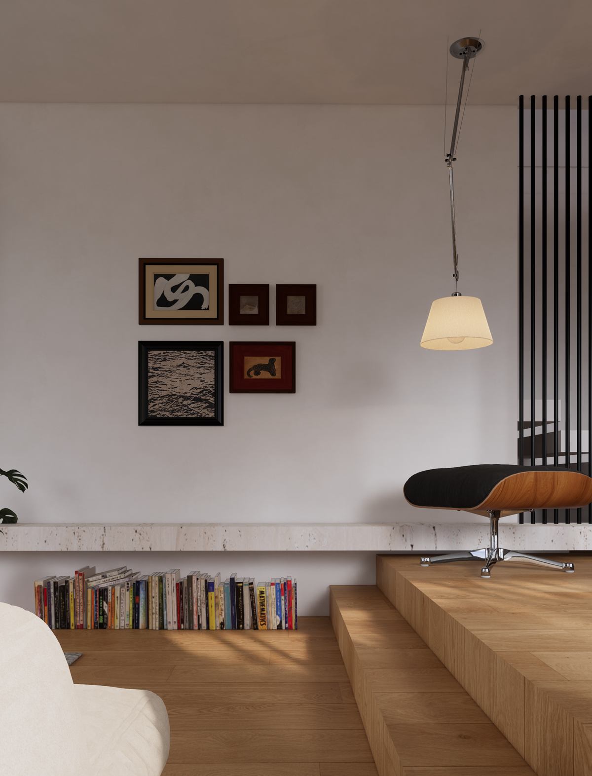 Timber steps with a low bookshelf, a lounge chair and framed prints on a white wall.