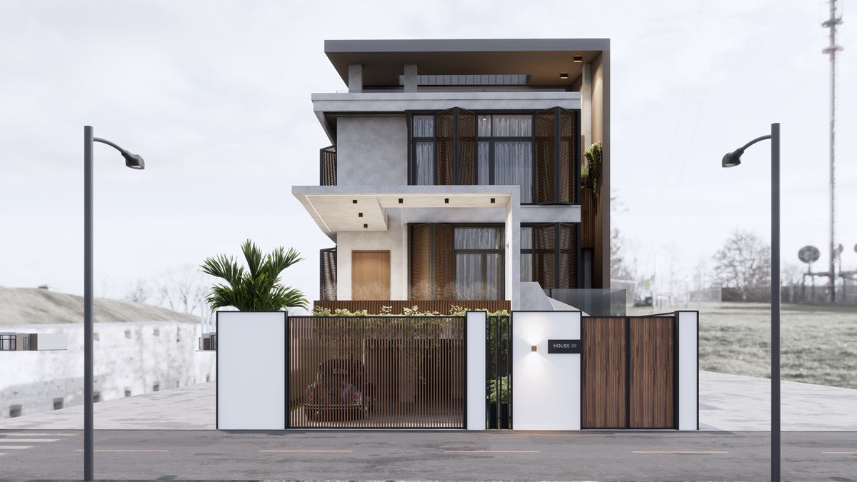 The house seen from the street, behind a white front wall with timber gates, between two street lamps.