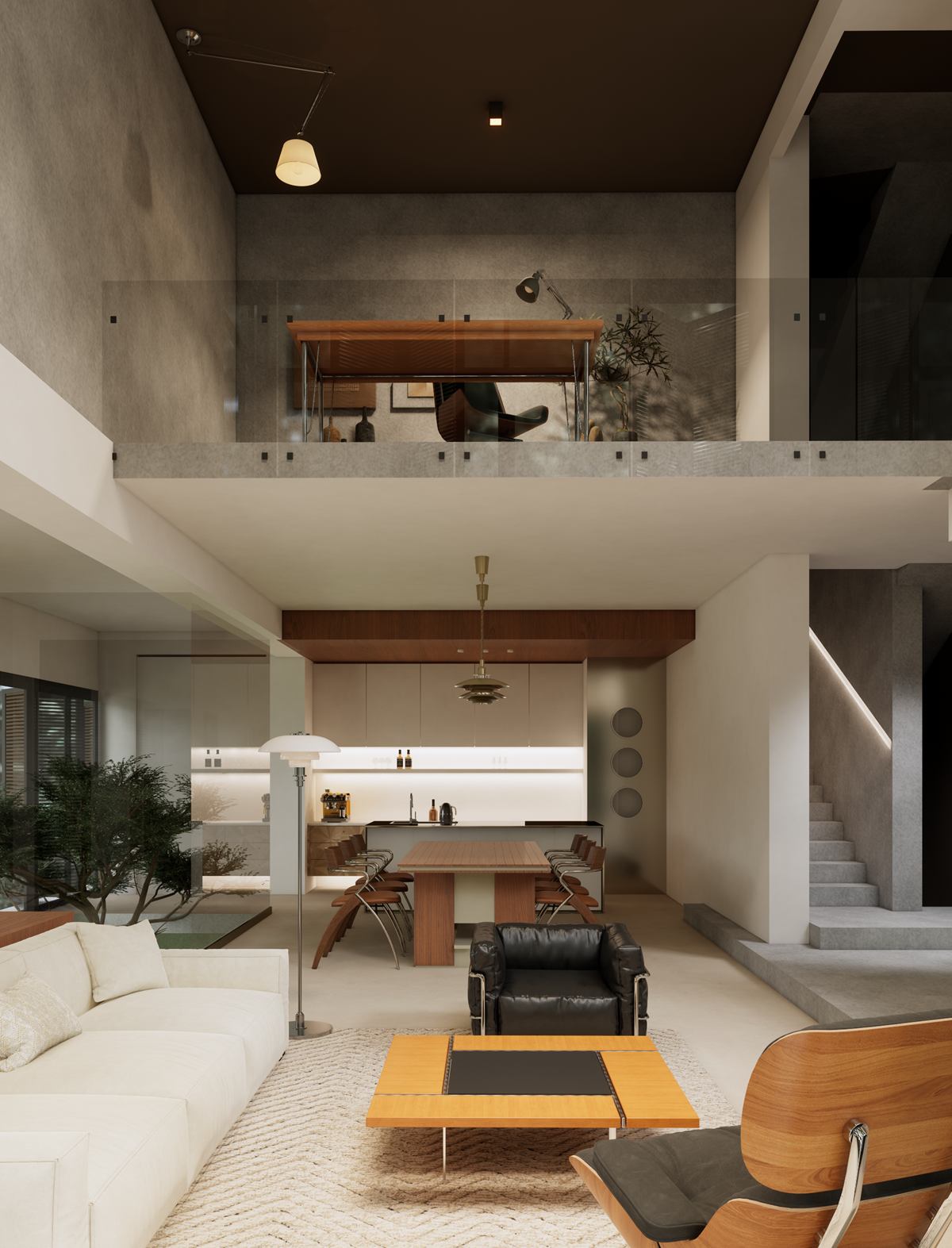 The double-height living room with a white sofa and leather armchairs, a mezzanine study with a glass balustrade above, and the kitchen beyond.
